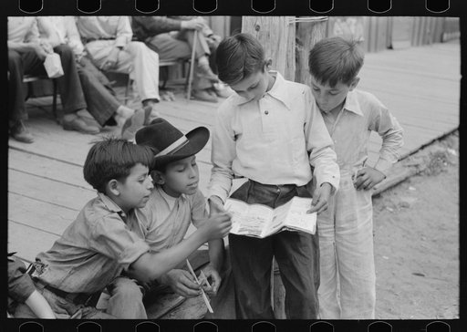 Children of gold miners looking at the comics, Mogollon, New Mexico