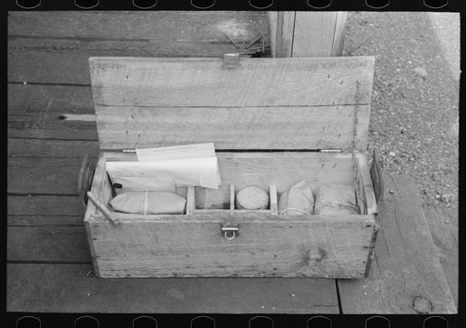 Box containing samples of milled tailing solutions which are sent to Silver City, New Mexico, for analysis. Mogollon, New Mexico
