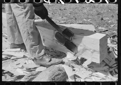 Using a broad axe to finish up a tie, Pie Town, New Mexico