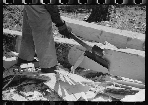 Using a broad axe to finish a tie, Pie Town, New Mexico