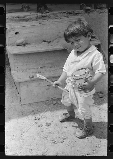 Untitled photo, possibly related to: Spanish-American boy playing horse, Chamisal, New Mexico