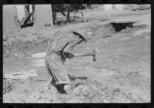 Untitled photo, possibly related to: Spanish-American mixing adobe plaster, Chamisal, New Mexico