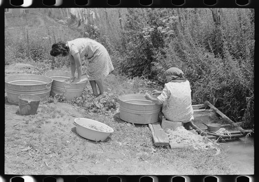 Untitled photo, possibly related to: Washing along the irrigation ditch, Chamisal, New Mexico