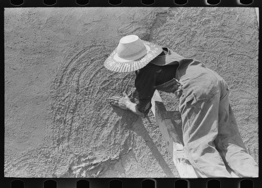 Untitled photo, possibly related to: Spanish-American women plastering adobe house, Chamisal, New Mexico