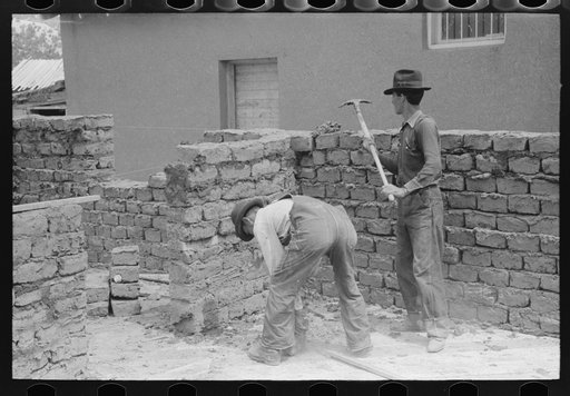 Constructing an adobe building, Penasco, New Mexico