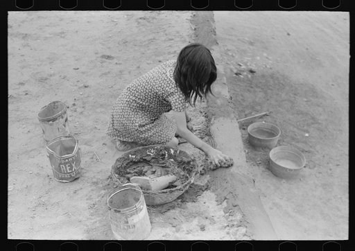 The rough adobe plaster is smoothed with raw wool and water. Costilla, New Mexico
