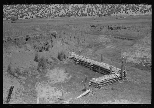 Revetment constructed by Soil Conservation Service to protect land from further washing. Chamisal, New Mexico