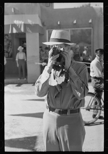 Tourist using candid camera, Taos, New Mexico