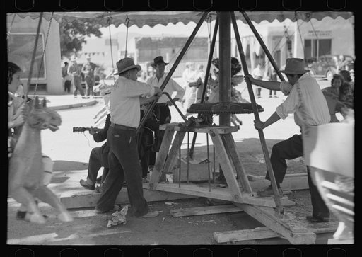 Untitled photo, possibly related to: Power for the old-fashioned merry-go-round is furnished by two husky Spanish-American men, Taos, New Mexico