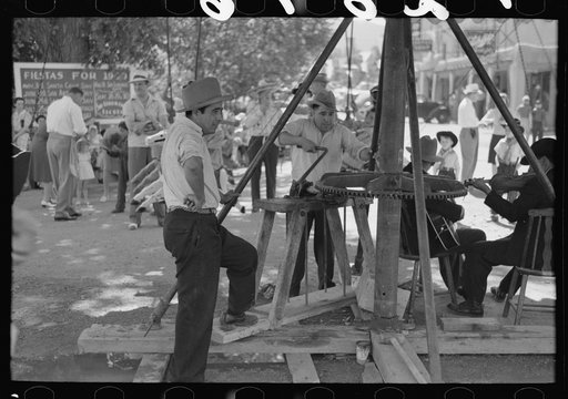 Untitled photo, possibly related to: Power for the old-fashioned merry-go-round is furnished by two husky Spanish-American men, Taos, New Mexico