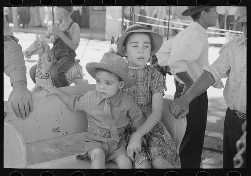 Untitled photo, possibly related to: Spanish-American children waiting for a ride on the merry-go-round, Fiesta, Taos, New Mexico