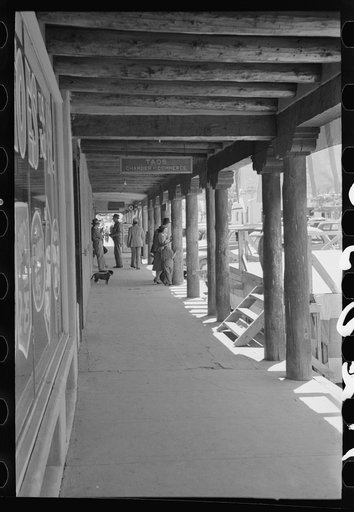 Stores around the main square at Taos, New Mexico, have covered sidewalks