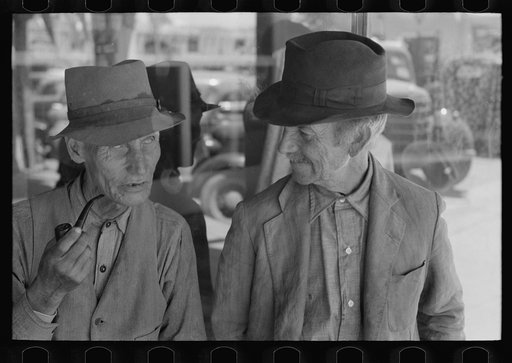 Men talking on the streets of Taos, New Mexico