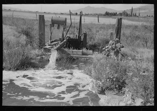 Untitled photo, possibly related to: Pumping water which was excess in irrigating one field to a higher level to be used again for irrigation. Box Elder County, Utah