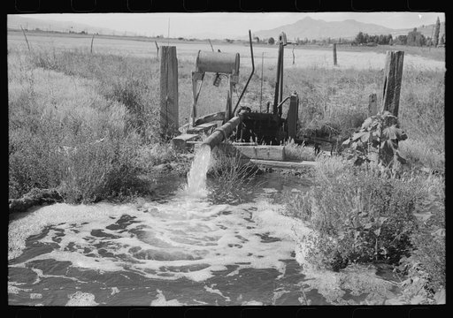 Pumping water which was excess in irrigating one field to a higher level to be used again for irrigation. Box Elder County, Utah