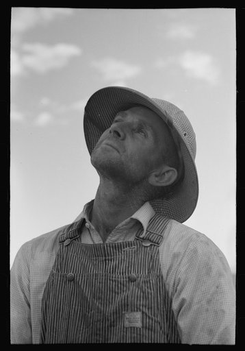 Untitled photo, possibly related to: Mormon farmer working on FSA (Farm Security Administration) cooperative drill, Oneida County, Idaho. While the members of the cooperative live in Snowville, Utah, some of them farm in Oneida County, Idaho