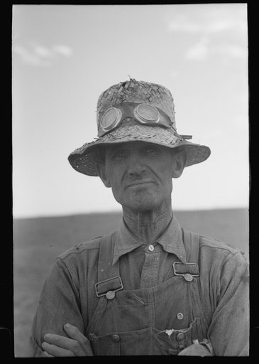 Untitled photo, possibly related to: Mormon farmer who lives in Snowville, Utah and who farms in Oneida County, Idaho, bagging wheat