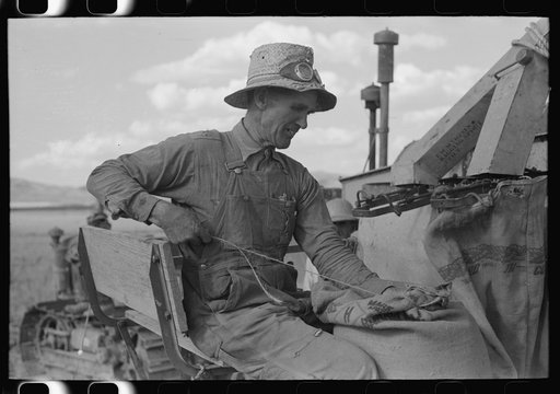 Mormon farmer who lives in Snowville, Utah and who farms in Oneida County, Idaho, bagging wheat