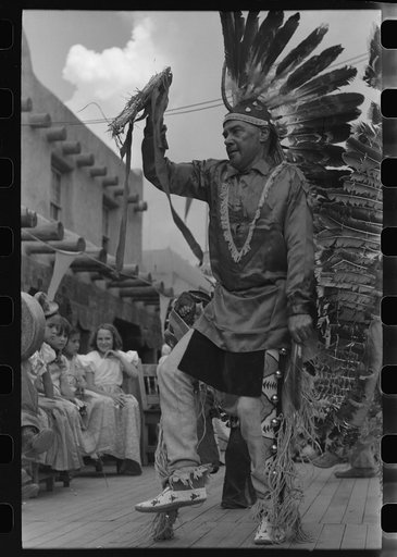 A member of the Forest Service who is participating in Indian dances at the fiesta, Taos, New Mexico
