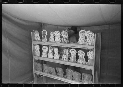 Knocking down dolls at booth at fiesta, Taos, New Mexico