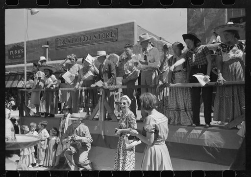 Untitled photo, possibly related to: Crowds lined the streets and stood on top of covered sidewalks to see the dances at the fiesta, Taos, New Mexico
