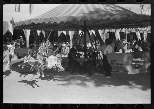 Untitled photo, possibly related to: The music for the merry-go-round. Fiesta, Taos, New Mexico