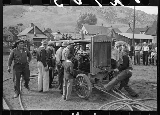 Cranking up motor which will supply power for the miners drilling contest, Labor Day celebration, Silverton, Colorado