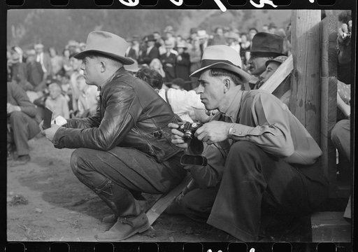 Candid cameraman at miners contest at Labor Day celebration, Silverton, Colorado