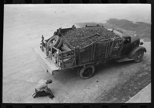 Untitled photo, possibly related to: Unloading gravel to be used in mine building construction, Ouray County, Colorado
