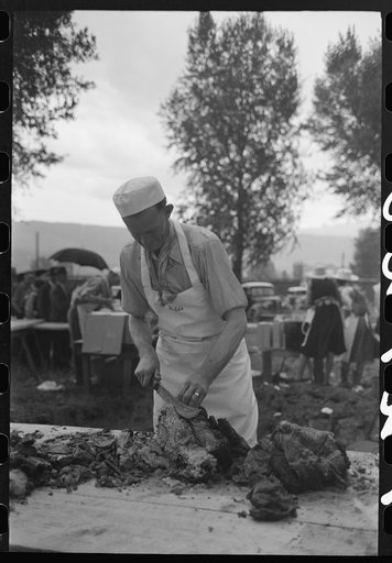 Untitled photo, possibly related to: Making barbecue sandwiches at the free barbecue on Labor Day, Ridgway, Colorado