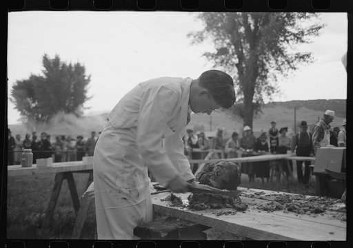 Untitled photo, possibly related to: Making barbecue sandwiches at the free barbecue on Labor Day, Ridgway, Colorado