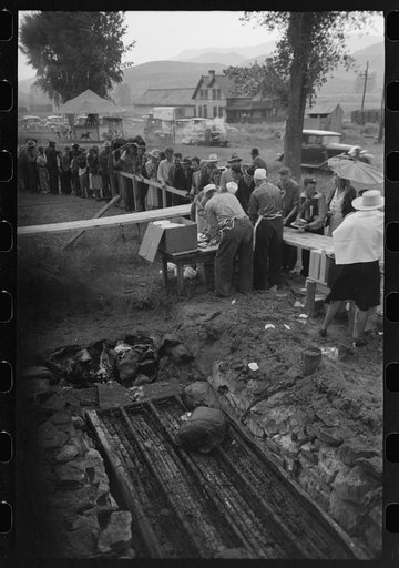 Barbecue pits and people standing in line to be served at the free barbecue at Labor Day, Ridgway, Colorado