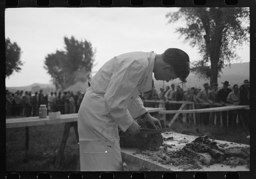 Slicing barbecue at the free barbecue on Labor Day at Ridgway, Colorado
