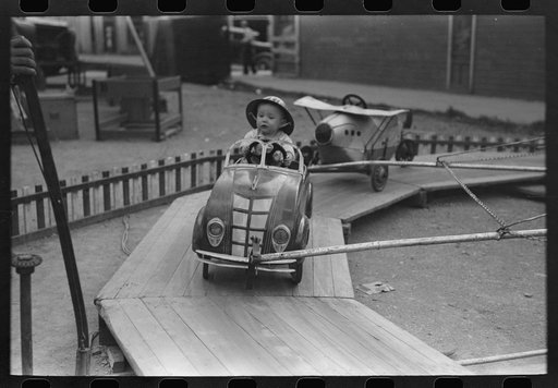 Untitled photo, possibly related to: People on one of the rides on amusement row at the Labor Day celebration, Silverton, Colorado