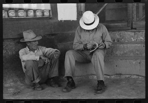 Residents of Concho, Arizona, sitting on the store steps