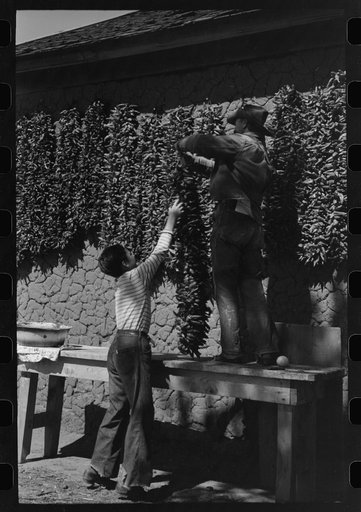 Untitled photo, possibly related to: Chili peppers drying on side of adobe house, Concho, Arizona