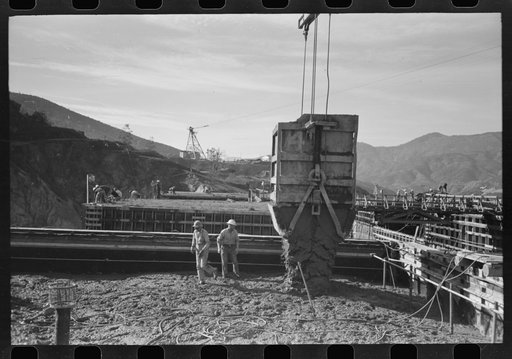 Untitled photo, possibly related to: Construction workers getting a drink of water. Main distributing tower is in the rear. Shasta Dam, Shasta County, California