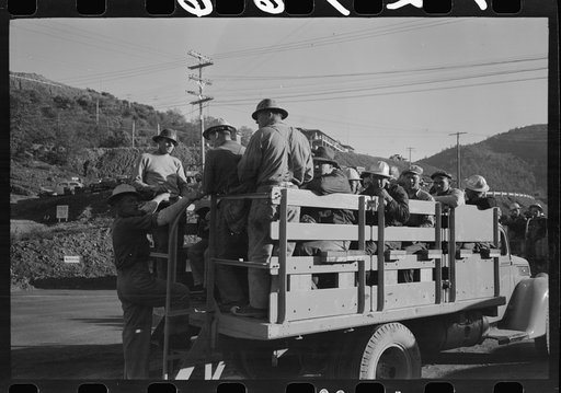 Untitled photo, possibly related to: Construction workers on truck which will carry them to work on Shasta Dam, Shasta County, California
