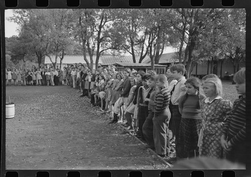 Children of construction workers watching high school horse at Summit City, California