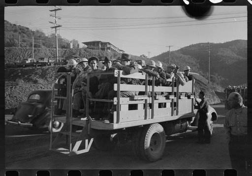 Untitled photo, possibly related to: Construction workers on truck which will carry them to work on Shasta Dam, Shasta County, California