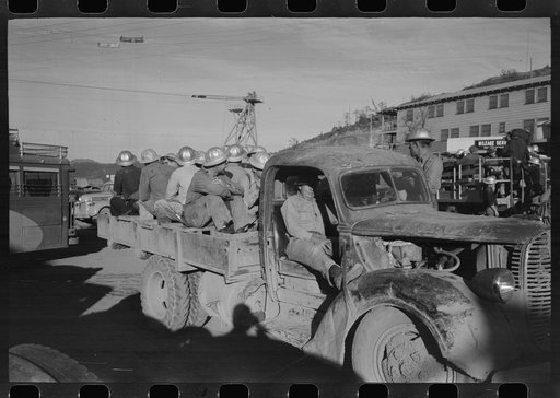 Construction workers on truck which will carry them to work on Shasta Dam, Shasta County, California