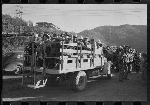 Untitled photo, possibly related to: Construction workers on truck which will carry them to work on Shasta Dam, Shasta County, California