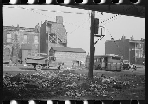 Untitled photo, possibly related to: Lunch wagon and apartment house under the Elevated in the Negro section of Chicago, Illinois