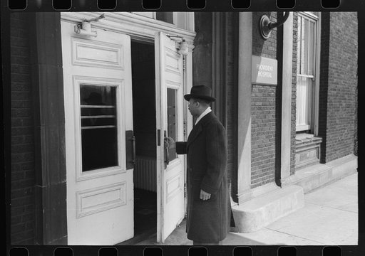 Untitled photo, possibly related to: Doctor entering Provident Hospital, South Side of Chicago, Illinois