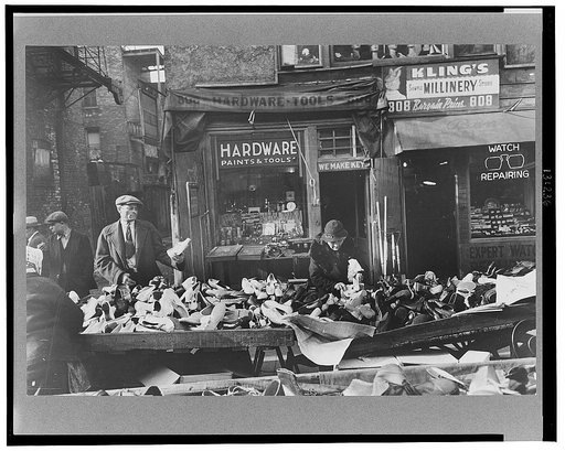 People shopping for shoes at shop on Maxwell Street, Chicago, Illinois