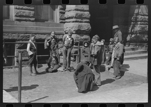 Marbles is a favorite game on South Side of Chicago, Illinois