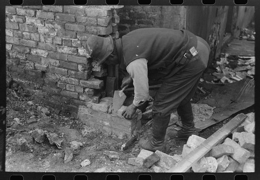 Repairing part of apartment building on South Side of Chicago, Illinois