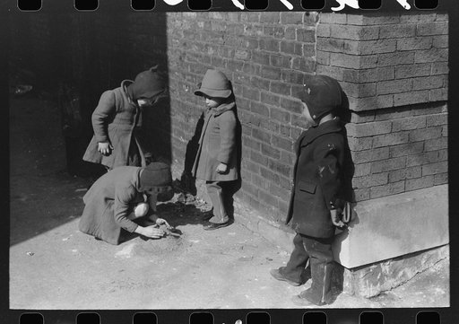 Where the Negro and white sections on the South Side meet, the white and Negro children sometimes play together, Chicago, Illinois