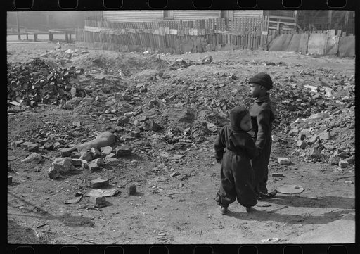 Children playing near dead dog, South Side of Chicago, Illinois