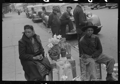Selling Easter lilies on sidewalk on Easter morning, South Side of Chicago, Illinois